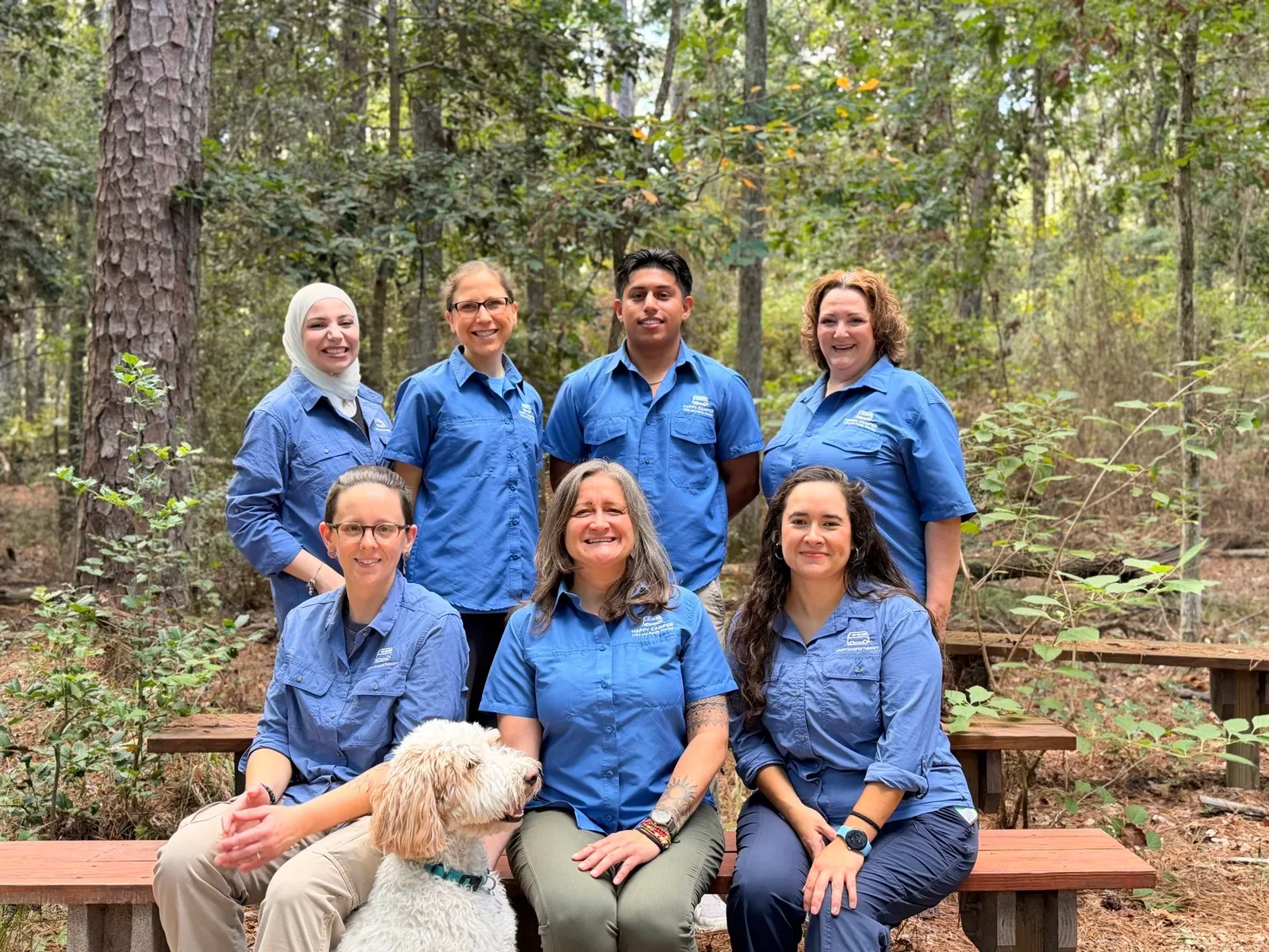 Happy Camper Child and Family Therapy team and Birdie, our therapy dog